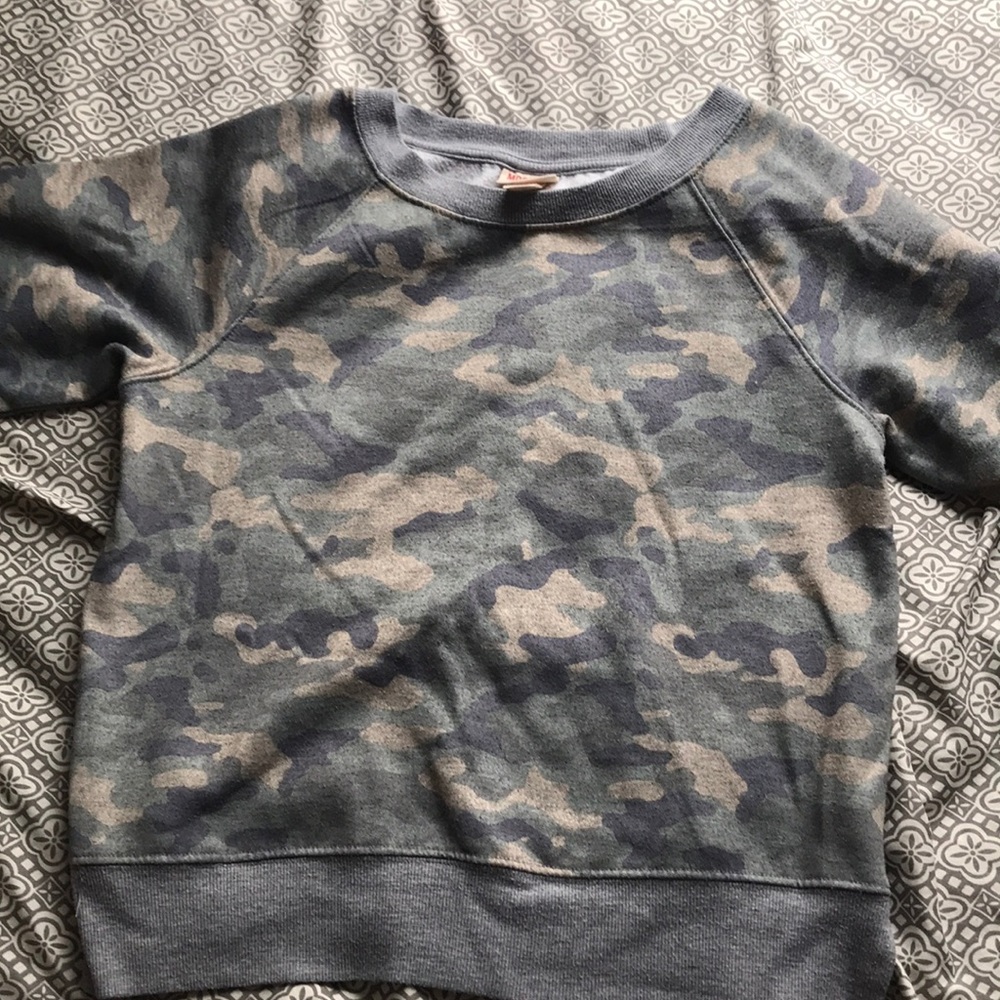 This is a camouflage long sleeve sweater.